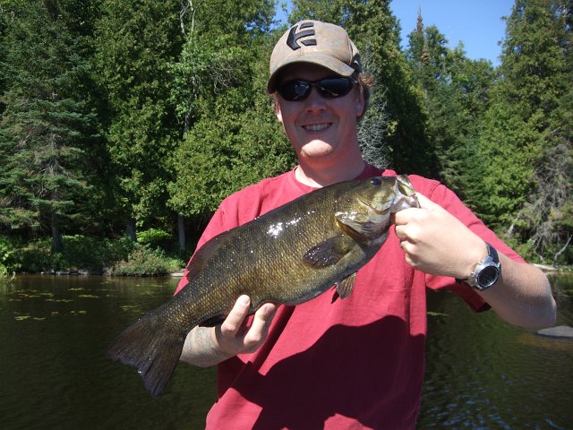 2011 Retreat 017.JPG - David with a 3 lb 11 oz small-mouth bass caught at Deer Lake – Elsmdale, Ont.